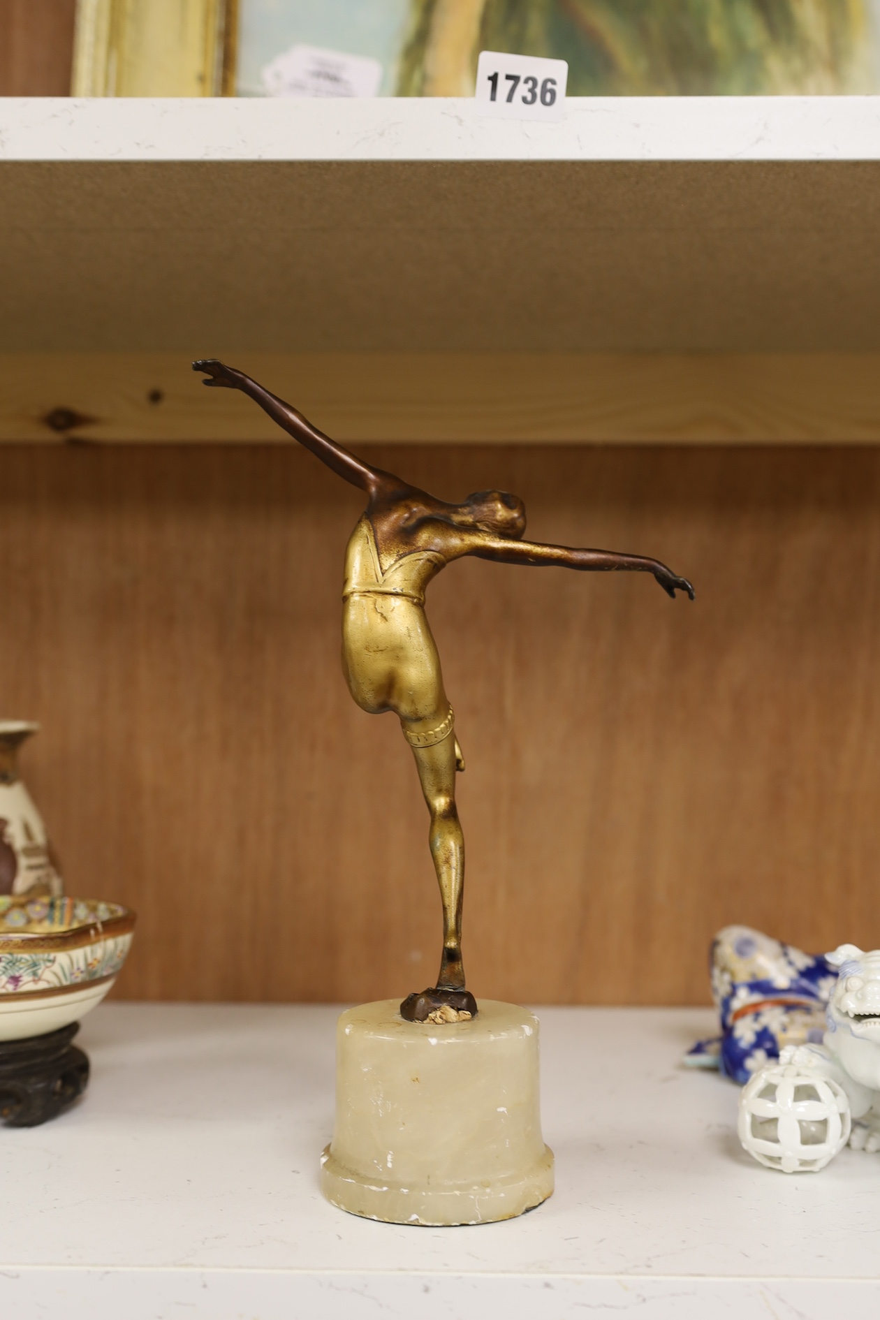 A gilt patinated spelter dancing figure after Chiparus, 27cm high. Condition - front of base of figure at the feet broken